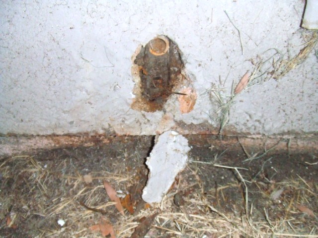 A/C condensation line was covered by stucco. Water damage in house